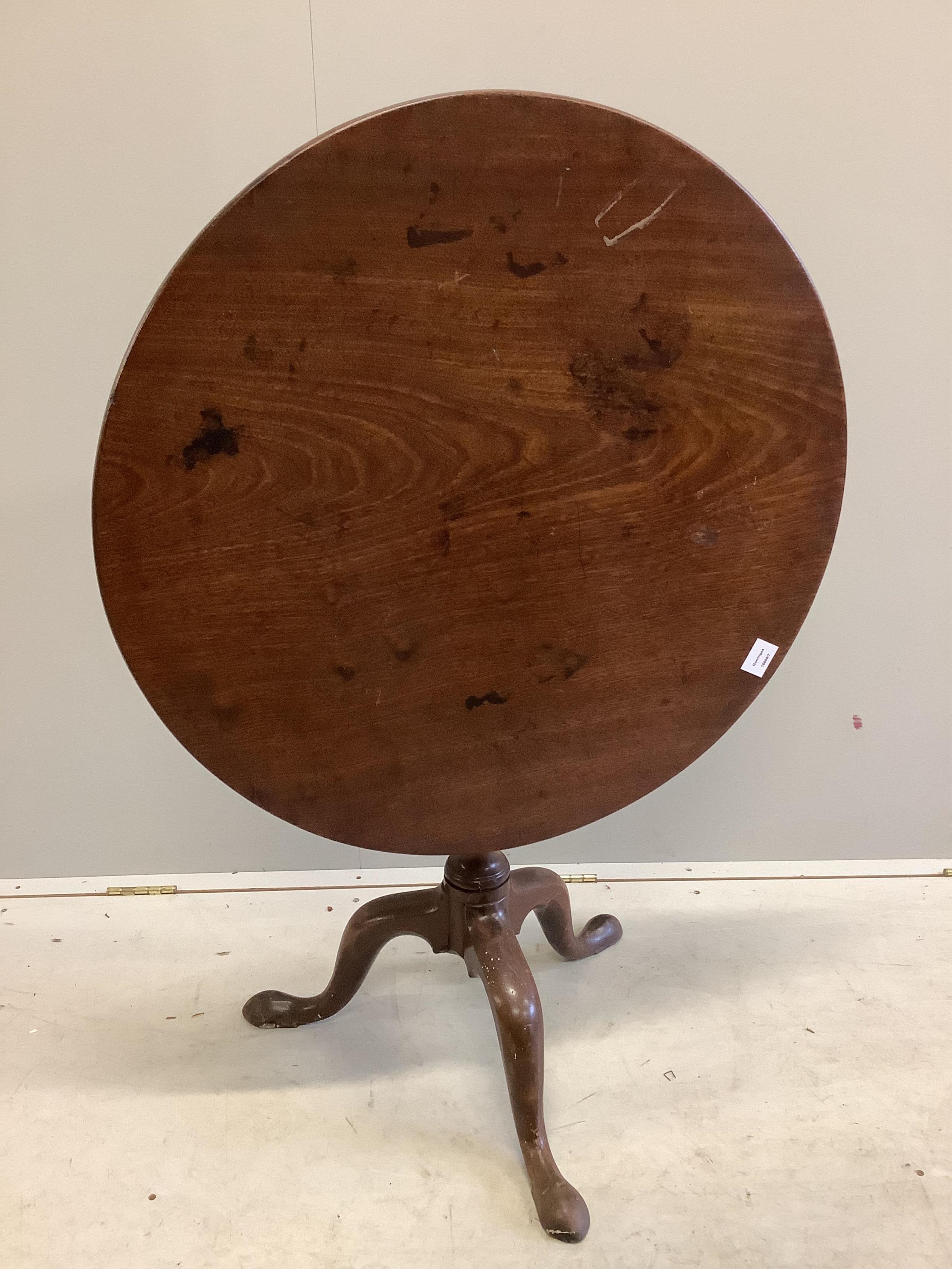 A George III circular mahogany tilt top tea table, diameter 78cm, height 71cm. Condition - fair